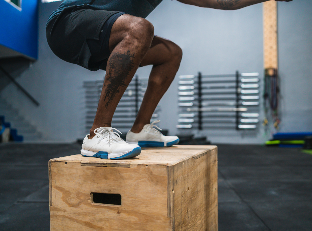 Athlete performing box jumps to improve VO₂ max and power output.