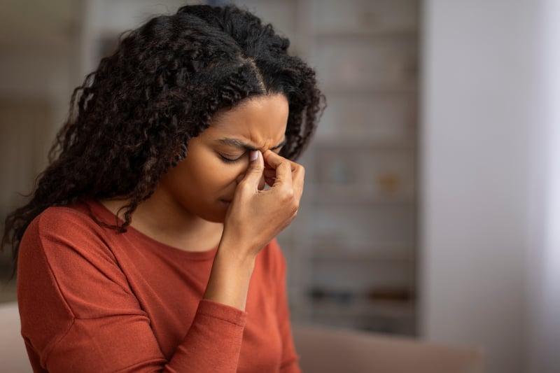Woman feeling fatigued who may benefit from gut testing