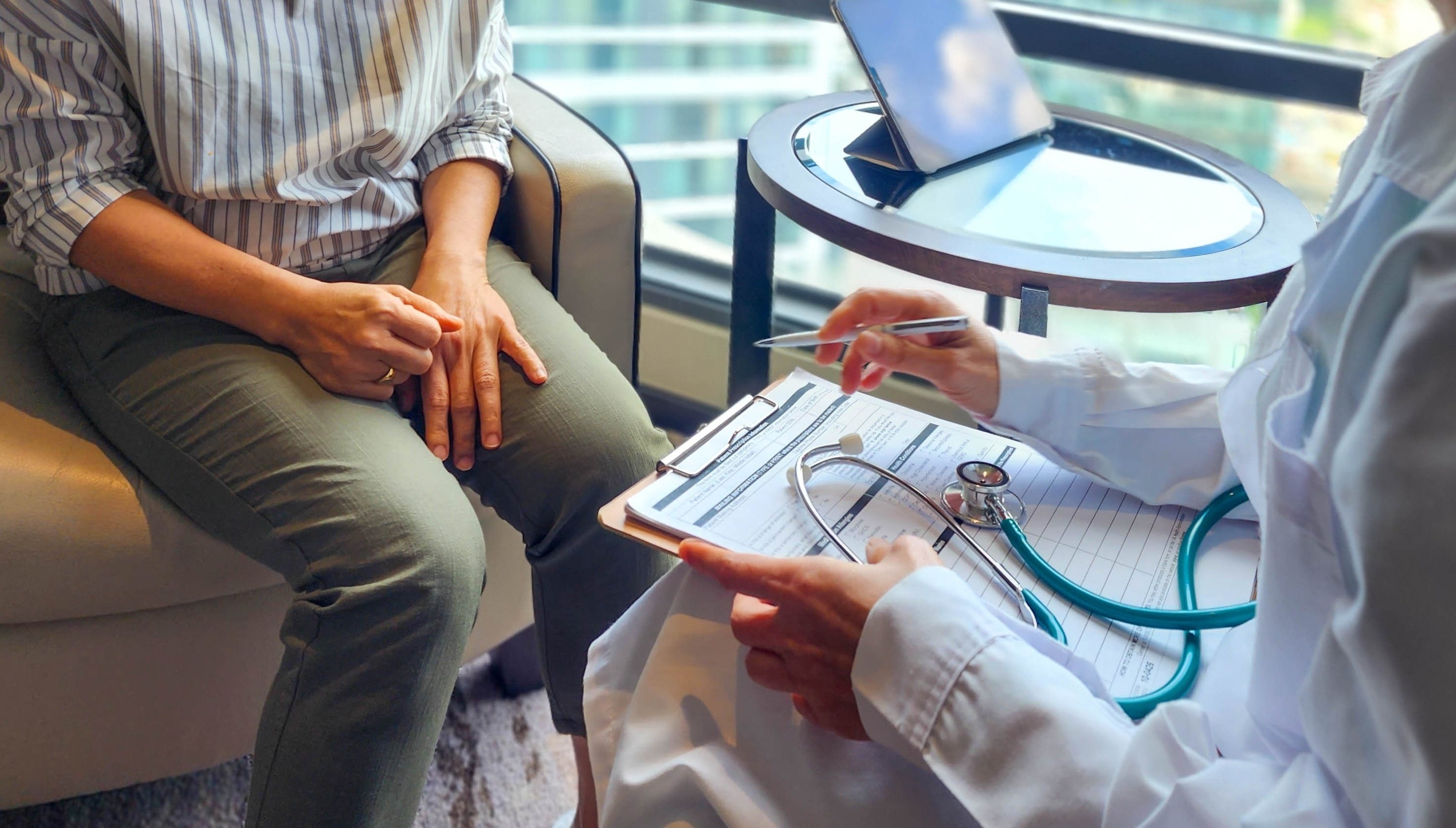 Patient talking to doctor